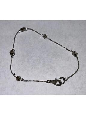 Delicate silver toned station bracelet